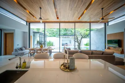 a living room with a couch and a table at Botanica Foresta 4BR Luxury Villa with Pool by NLA in Bang Tao Beach