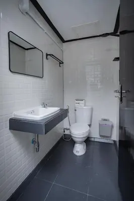a bathroom with a sink and a toilet at The Bright House, Koh Phi Phi in Phi Phi Don