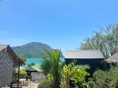 a house with a view of the ocean and mountains at Phi Phi Goodview Bungalow in Phi Phi Don