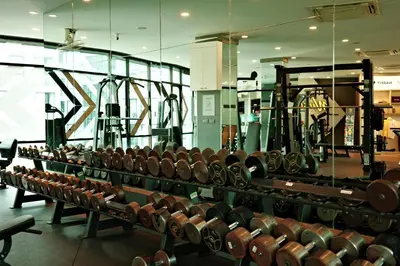 a room filled with lots of rows of dumbbells at City Gate Kamala D209 by Phuket Sabay Rent in Phuket Town