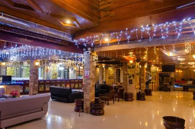 a lobby with couches and chandeliers at Diva Patong Hotel in Patong Beach
