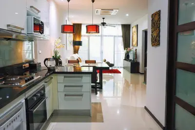 a kitchen with a counter and a dining room at Villa Casablanca in Ban Saiyuan (1)