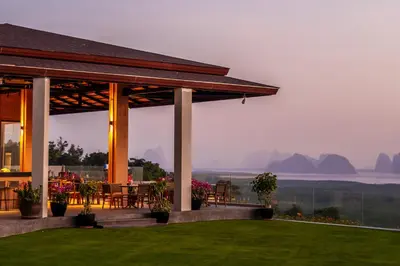 a pavilion with a table and chairs on a lawn at Beyond Skywalk Nangshi in Ban Met Nang Chi