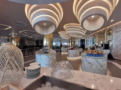 a restaurant with large chandeliers and tables and plates at Water park Rawai Beach 200m Nai Han king bedroom in Rawai Beach