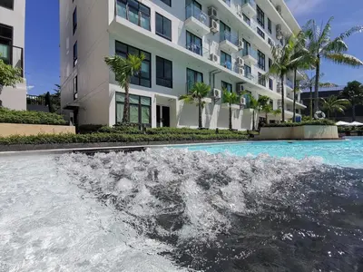a water fountain in front of a building at Water park Rawai Beach 200m Nai Han king bedroom in Rawai Beach