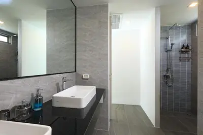 a bathroom with a white sink and a shower at 4bdr Pool Villa Suksan Rawai by CapitalPro SUK-20-154 in Phuket Town