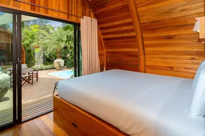 a bedroom with a bed and a large window at Tropical Chalet 2BR Villa Pasak Paradise 1 with Private Pool, Laguna 10 min drive in Bang Tao Beach