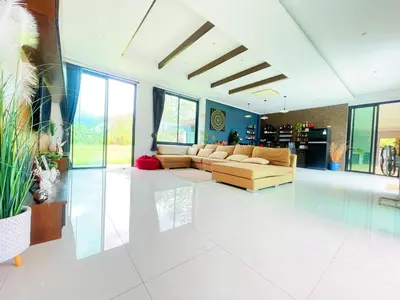 a large living room with a couch and a table at Spacious Private Villa Modern Style near beach in Thai Muang