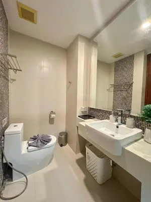 a bathroom with a toilet and a sink at 1 Bedroom Rawai Walk to beach in Rawai Beach