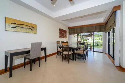 a dining room with a table and chairs at Angsana Villas Laguna-3 Bedroom Pool Villa in Phuket Town