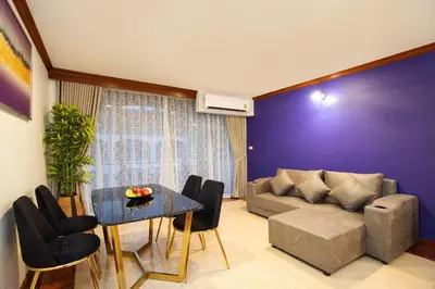 a living room with a couch and a table at Aspira Resort Klong Muang Krabi in Klong Muang Beach
