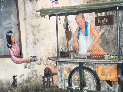 a painting of a man preparing food in front of a woman at Phuket Sunny Hostel in Phuket Town
