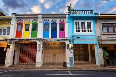 a colorful building on a city street at Phuket Sunny Hostel in Phuket Town