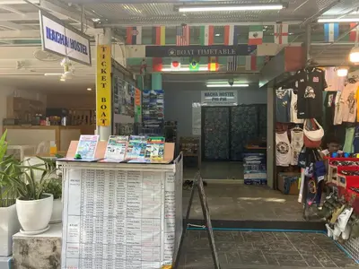 a store with a sign in the middle of a store at Nacha Hostel, Koh Phi Phi, Krabi. THAILAND in Phi Phi Don