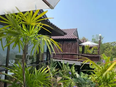 a view of a house from the garden at Phu Samut in Ban Ba Kan Pa