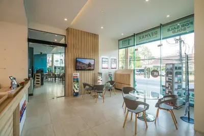a restaurant with chairs and a table and a dining room at Sea view apartment at Oceana by Lofty in Kamala Beach