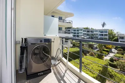 a washing machine on the balcony of a condo at Woodbridge Property at Karon Butterfly in Karon Beach