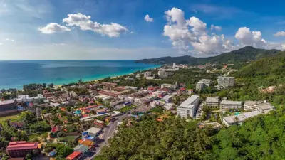 an aerial view of a town next to the ocean at Woodbridge Property at Karon Butterfly in Karon Beach
