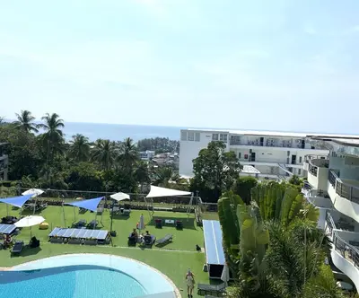 an overhead view of a swimming pool and the ocean at Woodbridge Property at Karon Butterfly in Karon Beach