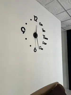 a clock on a wall with letters on it at Lo Sfizio in Patong Beach