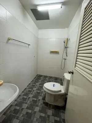 a bathroom with a toilet and a sink and a tub at Genesis Urban Phuket in Ban Lo Long