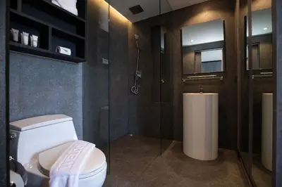 a bathroom with a toilet and a shower at tropics Kamala CTG L604, near FantaSea & Café Del Mar Beach Club in Kamala Beach