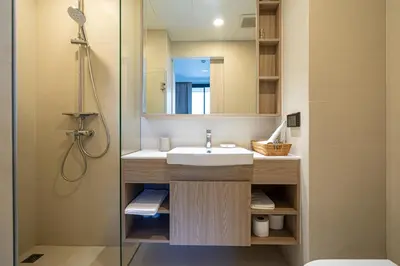 a bathroom with a sink and a shower at SkyPark Bangtao, Laguna 2 bedroom apartment 5 minutes from the beach in Phuket Town