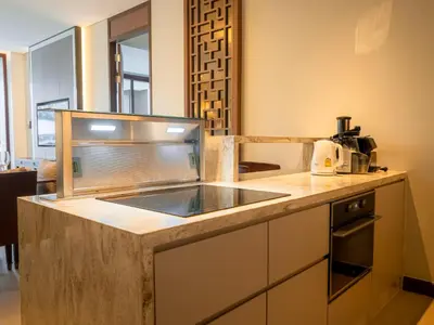 a kitchen with a counter top with a sink at ANGSANA Oceanview Apartments with a privat pool in Laguna area in Bang Tao Beach
