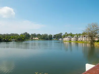 a view of a river with houses and condos at ANGSANA Oceanview apartments with jacuzzi in Laguna area in Bang Tao Beach