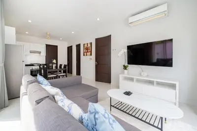 a living room with a couch and a tv at Villa in Ravai , 2 bedrooms in Ban Saiyuan (1)