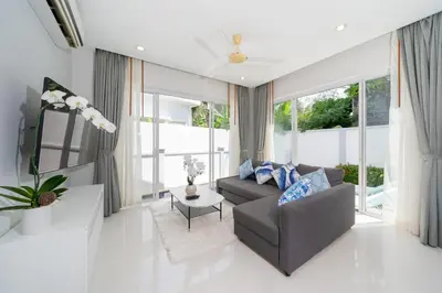 a living room with a couch and a table at Villa in Ravai , 2 bedrooms in Ban Saiyuan (1)