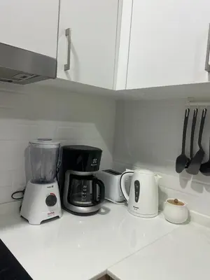a kitchen counter with a blender and other appliances at Apartment Karon 62 sq in Karon Beach