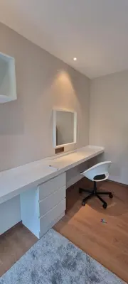 a white desk with a mirror and a chair at Title V in Rawai Beach
