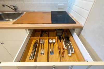 a kitchen drawer with knives and utensils in it at F12 Номер Люкс Бассейн Рубль ВАТСАП669З582I976 in Nai Yang Beach