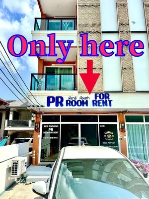 a sign on a building with a car parked in front at PR ROOM FOR RENT in Kamala Beach