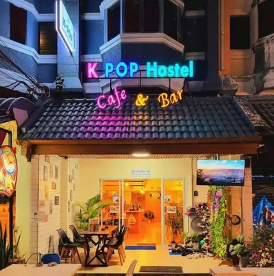 a restaurant with a sign that reads pop hostel cafe and bar at KPOP Hostel in Karon Beach
