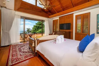 a bedroom with two beds and a large window at Seaview 5BR Pool Villa Apsara, Free Breakfast and Full Service, 5 min walk to Kata Beach in Kata Beach