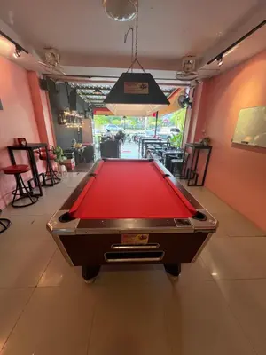 a pool table in the middle of a room at 84 Bar & Guest House in Ban Huai Luk (1)