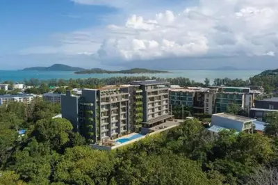 an aerial view of a city with buildings at Calypso rawai seaview apartment 600m walk to beach C4 in Phuket Town