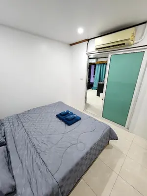 a bedroom with a bed and a sliding glass door at 2 Bedroom apartments 1 min to sea in Patong Tower in Patong Beach