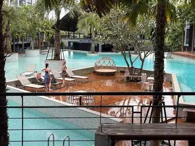 two girls are playing in a swimming pool at Kamala Beach P33 Pool view 2 Bedroom Suite in Kamala Beach