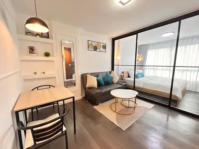a living room with a bed and a couch at Vibe Old Town 452 in Phuket Town