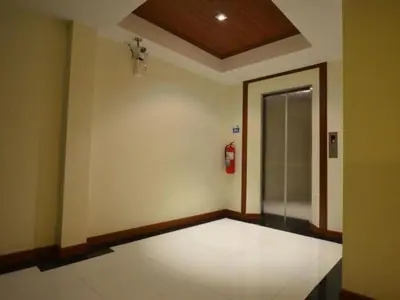 an empty room with a fire hydrant on the wall at Patong Terrace Hotel in Patong Beach