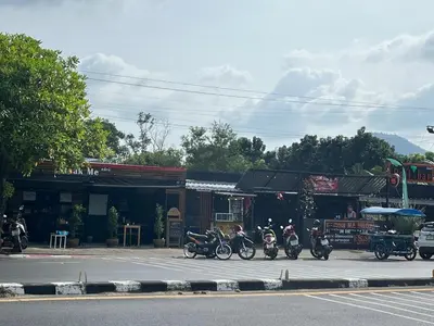 a group of motorcycles parked in front of a store at Bayok 11 - 2 Bedrooms 2 Bathrooms Villa Near Kathu Waterfall in Ban Huai Luk (1)