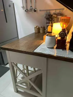 a counter with a table with a lamp on it at The Regent Kamala Penthouse with private pool in Kamala Beach