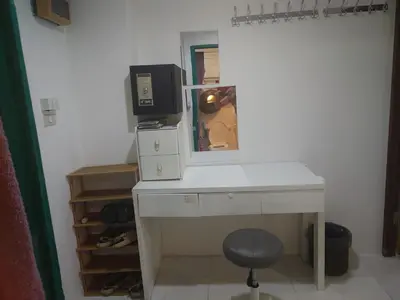 a desk with a computer and a monitor on it at Phuket Palace apartment with 2 separate rooms in Patong Beach