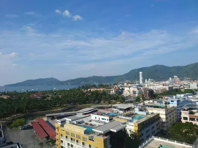 an aerial view of a city with a river and buildings at Phuket Palace apartment with 2 separate rooms in Patong Beach