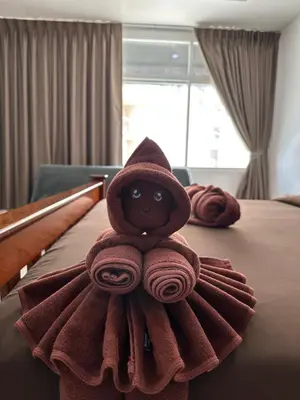 a teddy bear made out of towels on a bed at BT hotel Kata Beach in Kata Beach