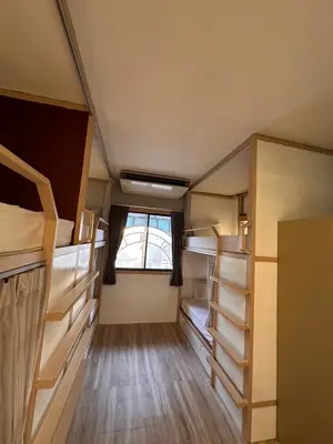 a small room with bunk beds and a window at Terminal58hostel@town in Ban Lo Long