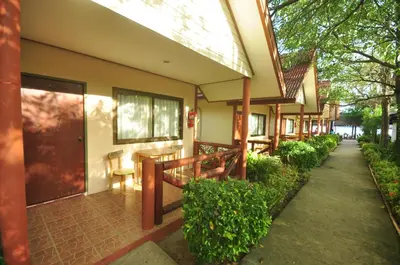 a building with a walkway next to a building at Phi Phi Rimlay Resort in Phi Phi Don